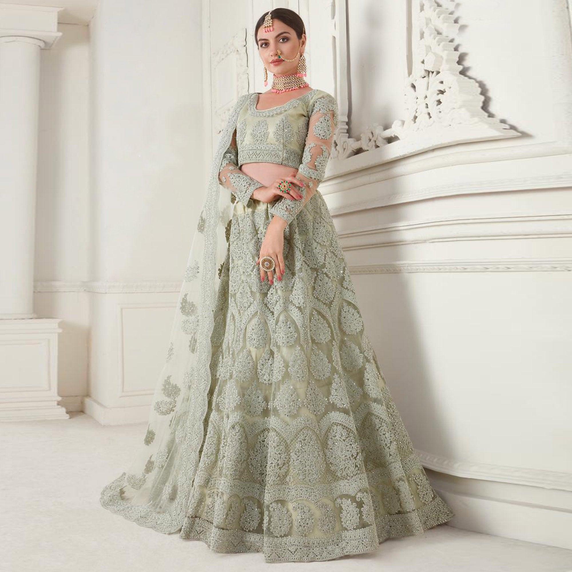Peachmode Glorious Mint Green Colored cording Embroidery Wedding Wear Net Lehenga Choli