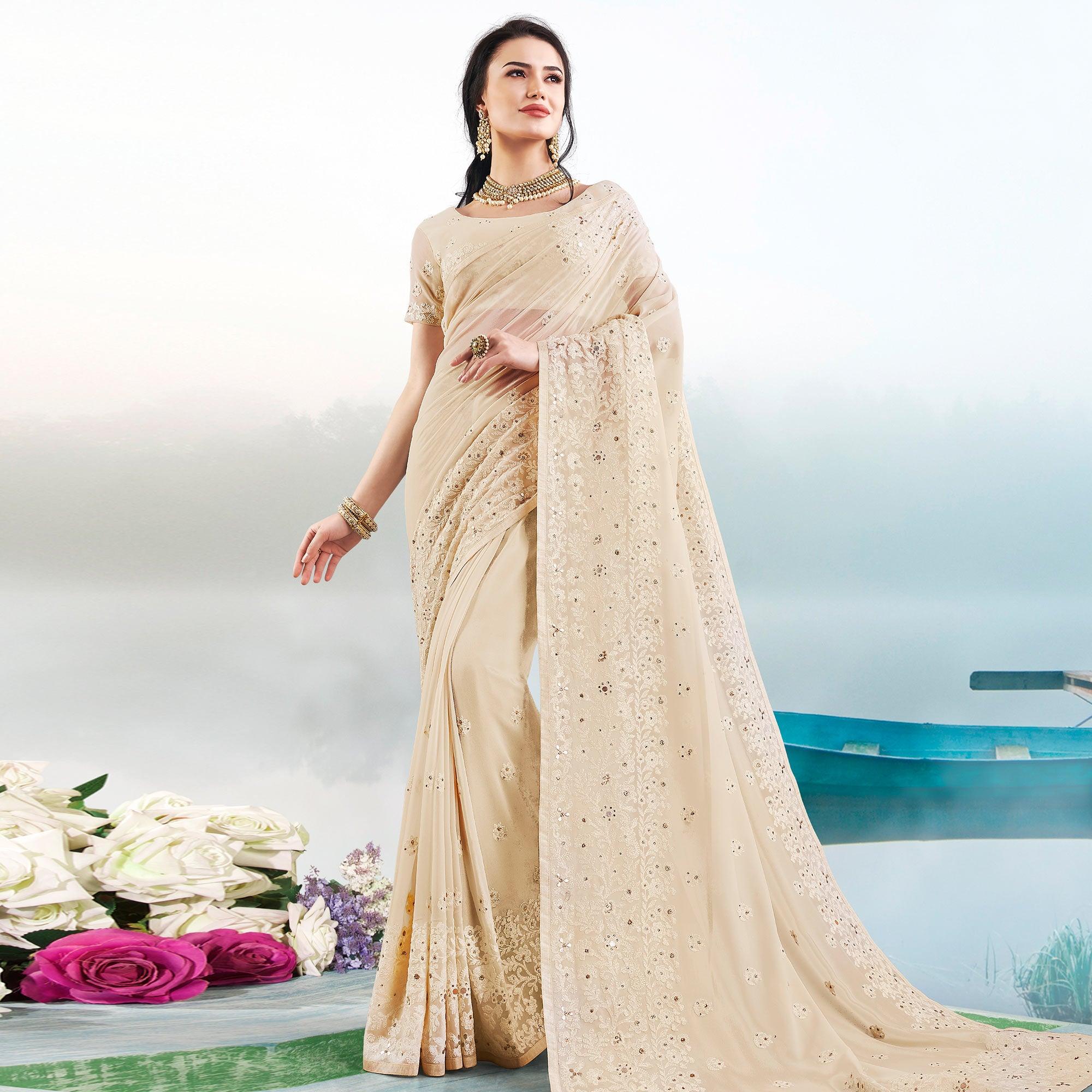 Peachmode Demanding Beige Colored Partywear Embroidered Georgette Saree