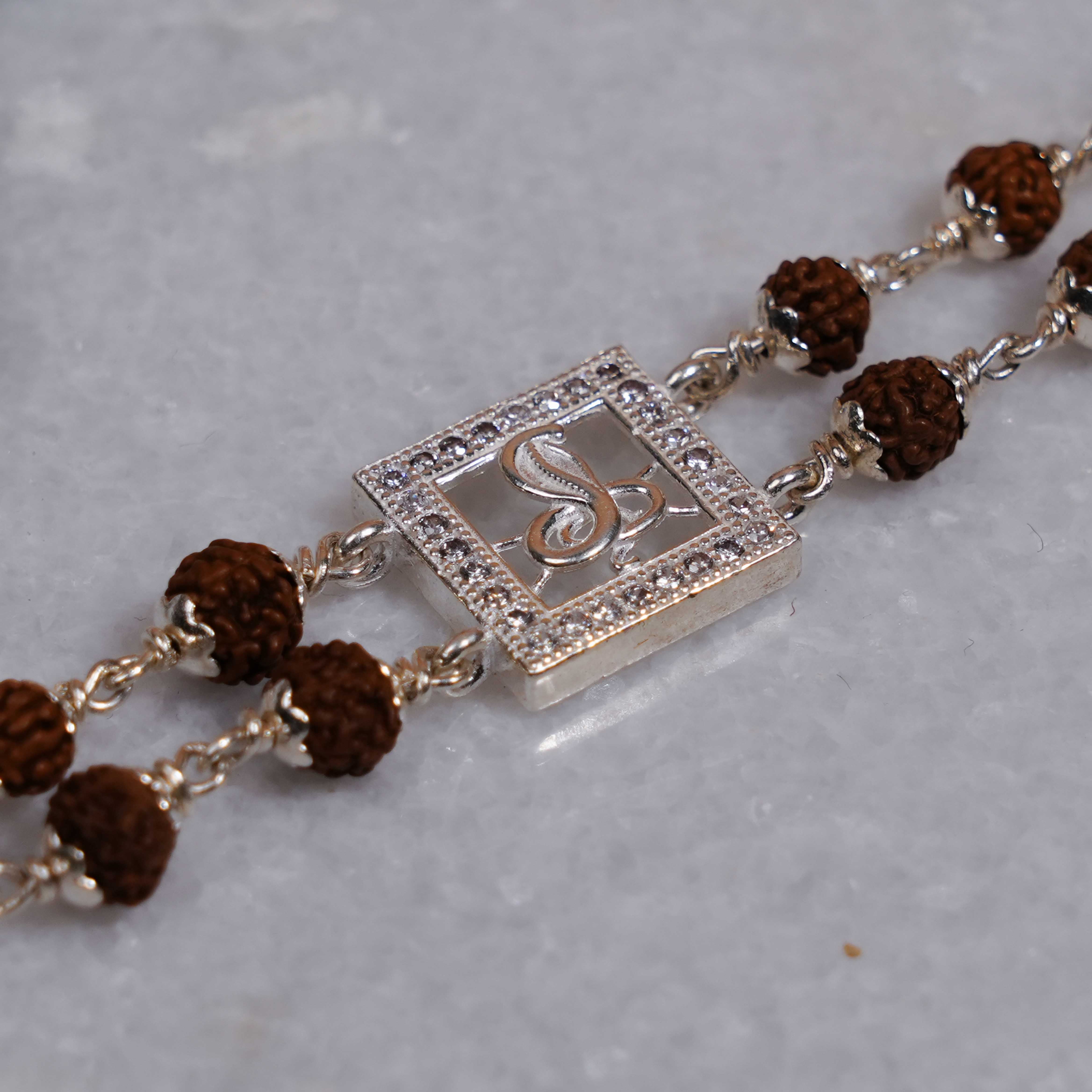 Prinjal Jewellers Rudraksha Silver bracelet with single Naag double line for men