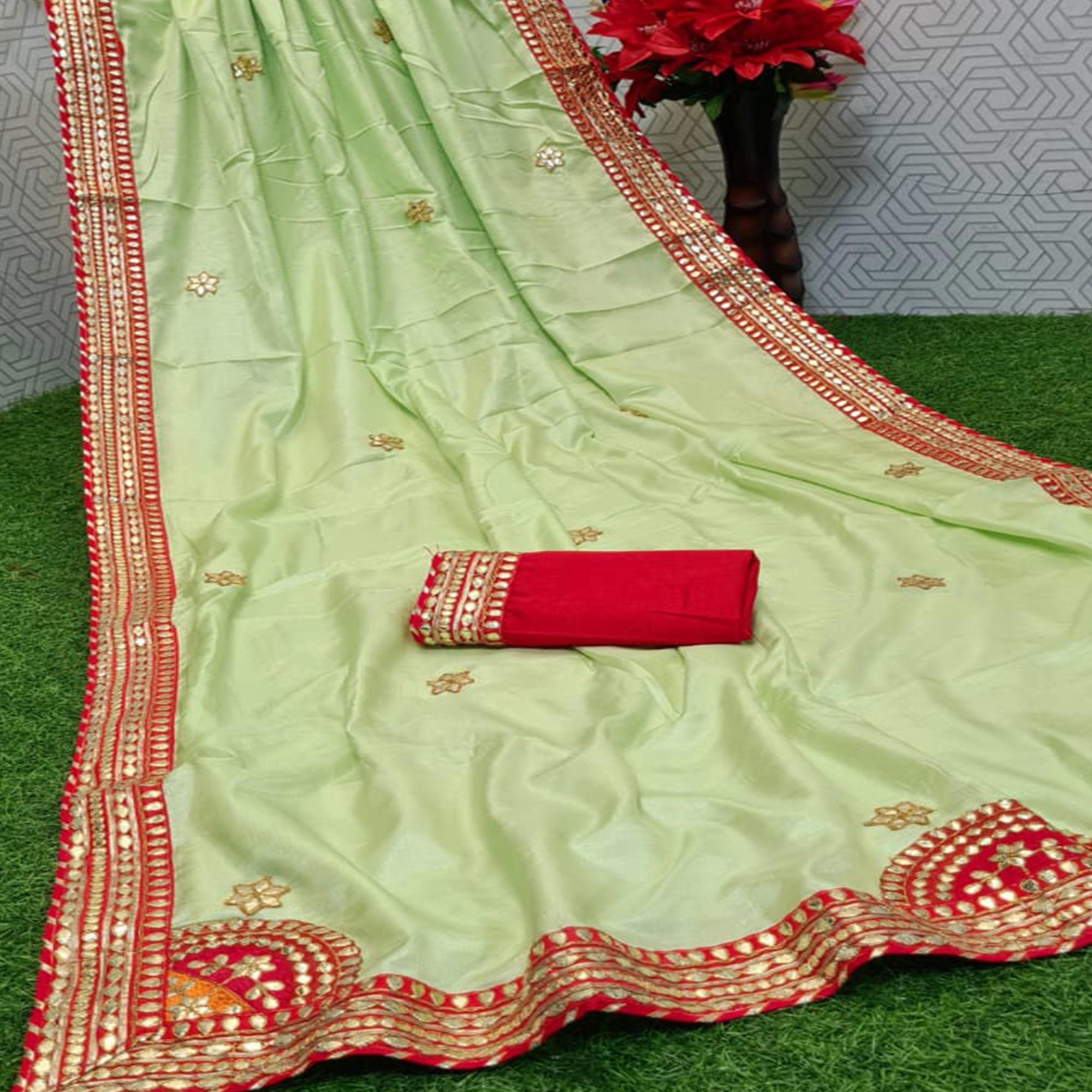 Peachmode Majesty Pista Green Coloured Casual Wear Printed Dola Silk Saree