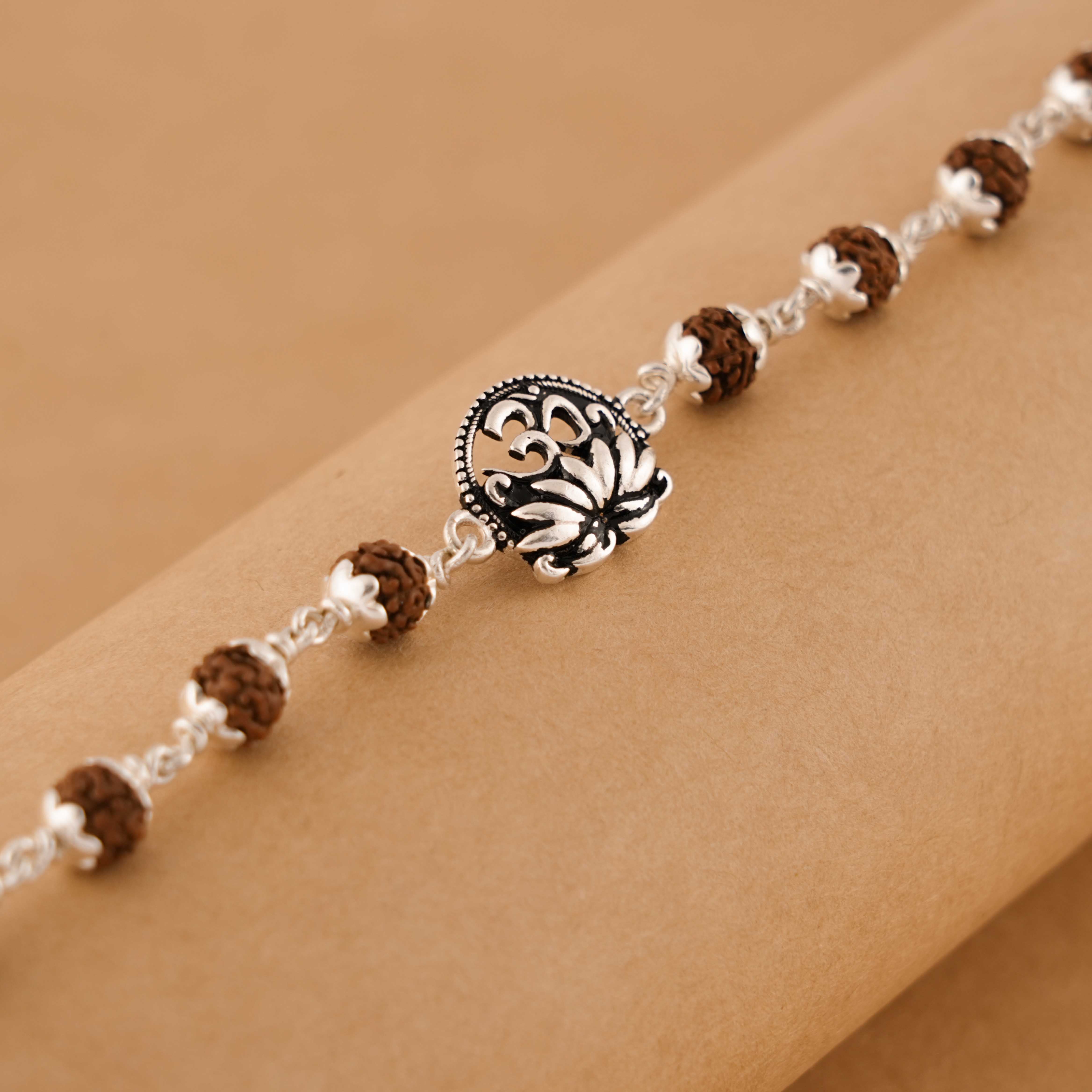 Prinjal Jewellers Silver Rakhi with Om and Lotus Flower and Single Line Rudraksha for Men - view 3