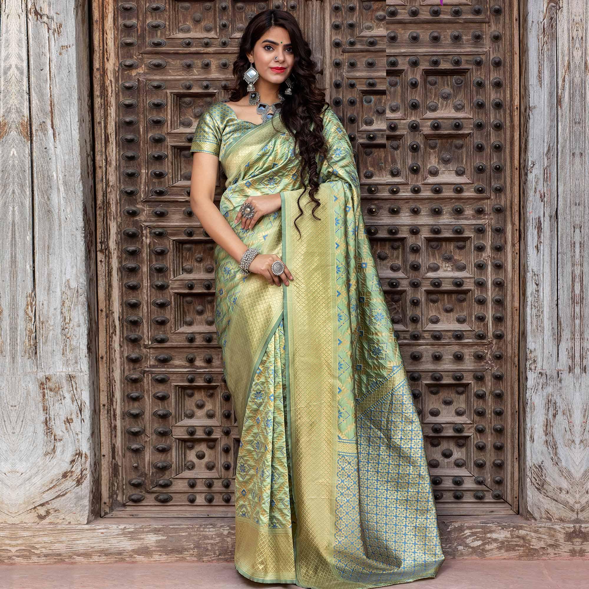 Peachmode Hypnotic Pista Green Colored Festive Wear Woven Banarasi Silk Saree