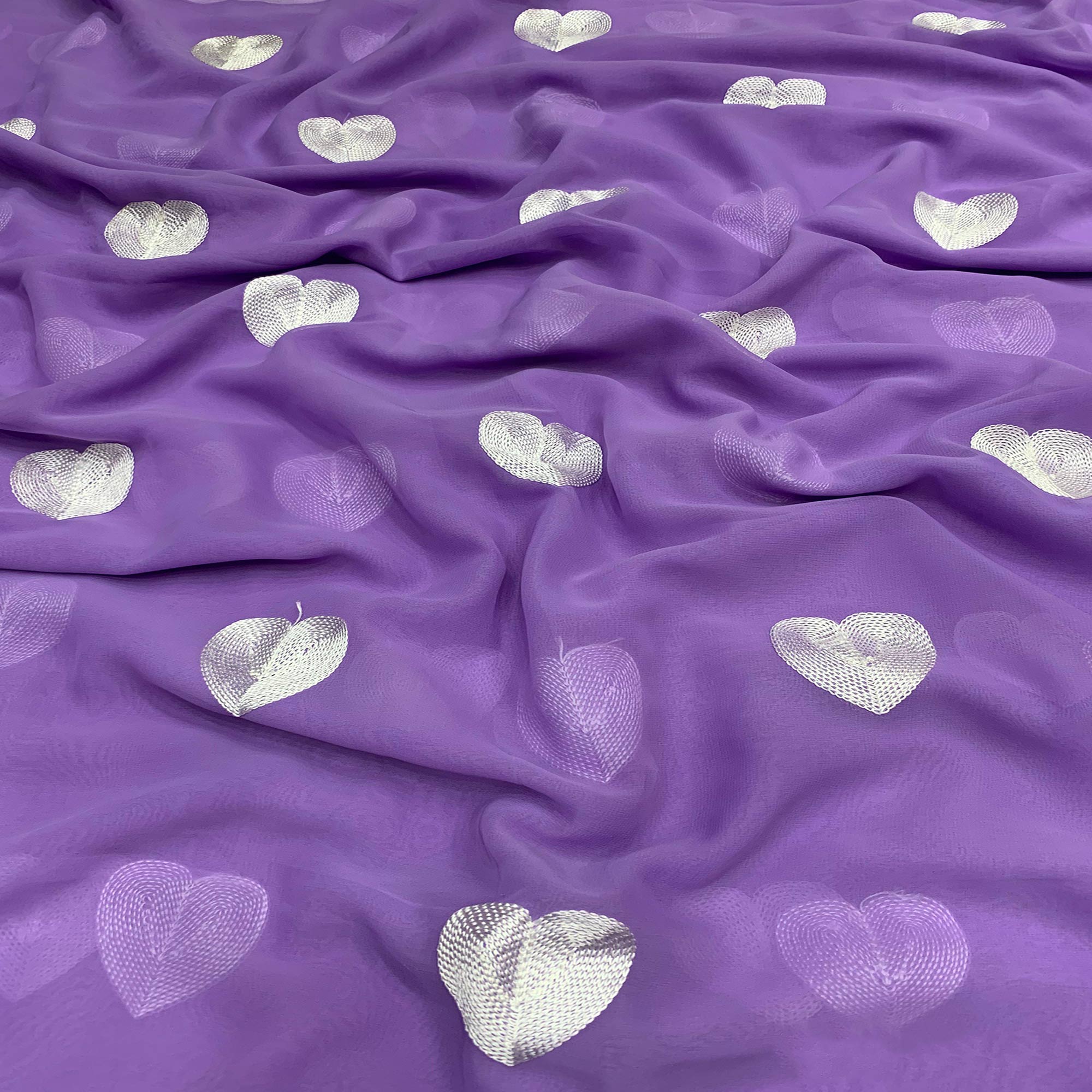 Peachmode Lavender Embroidered Georgette Saree
