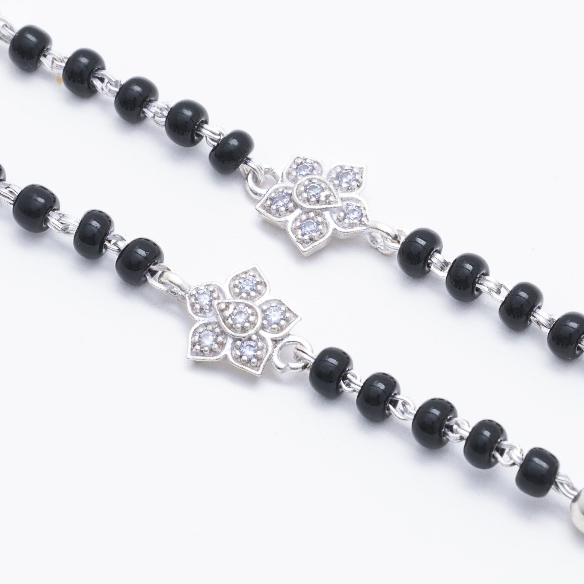 Prinjal Jewellers black beads with silver flower nazariya for kids