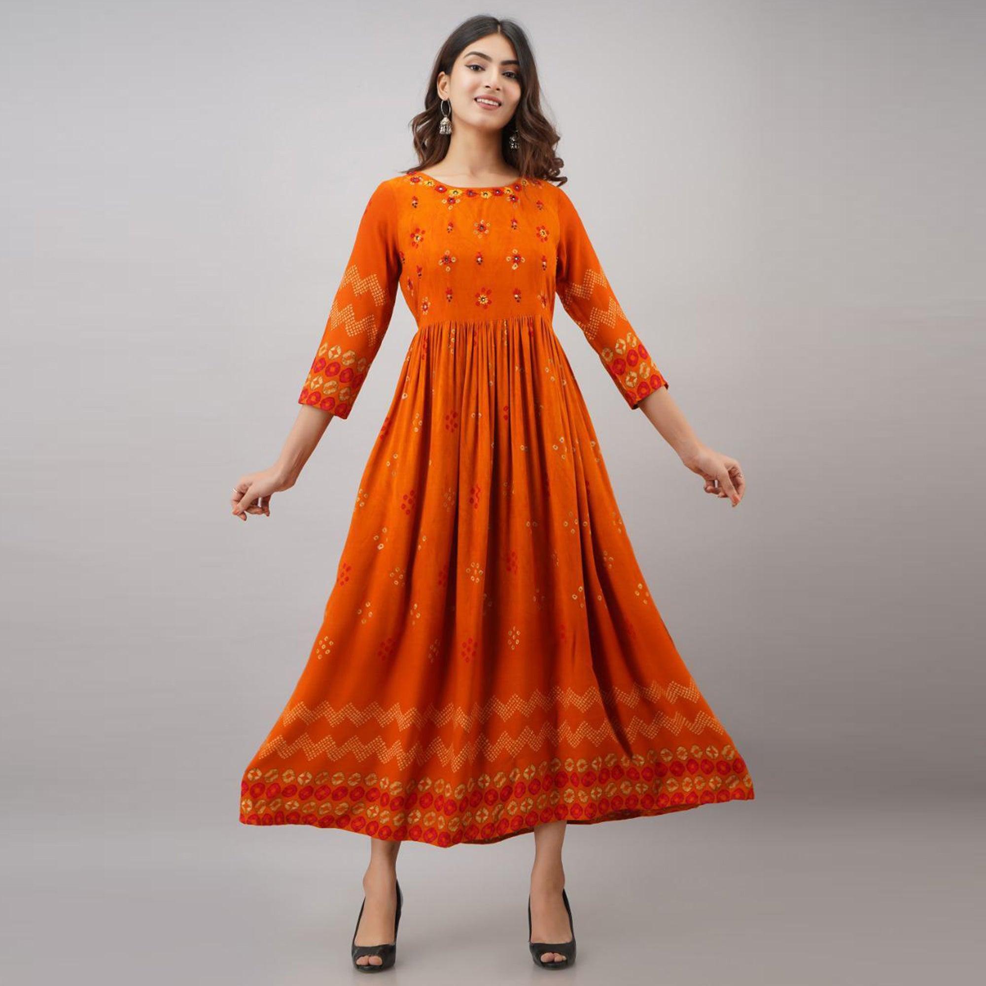 Peachmode Impressive Orange Colored Partywear Embroidered Muslin Long Kurti