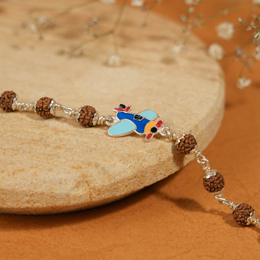Prinjal Jewellers Rudraksha Silver Bracelet with Colorful Airplane Single Line for Kids