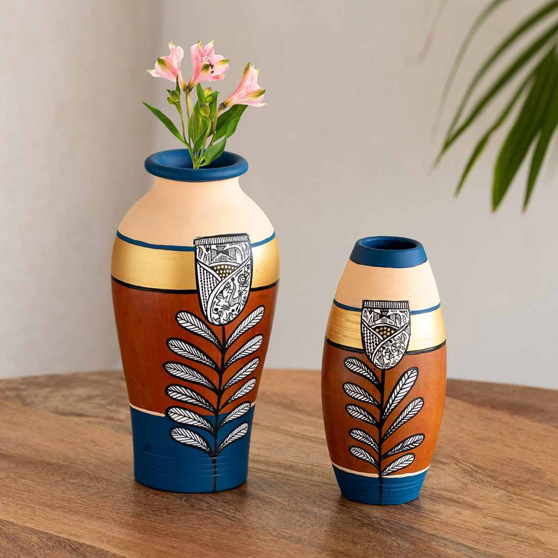 EXCLUSIVELANE 'Tulip Warli Tales' Hand-Painted Terracotta Vases (Set of 2, Brown & Blue)