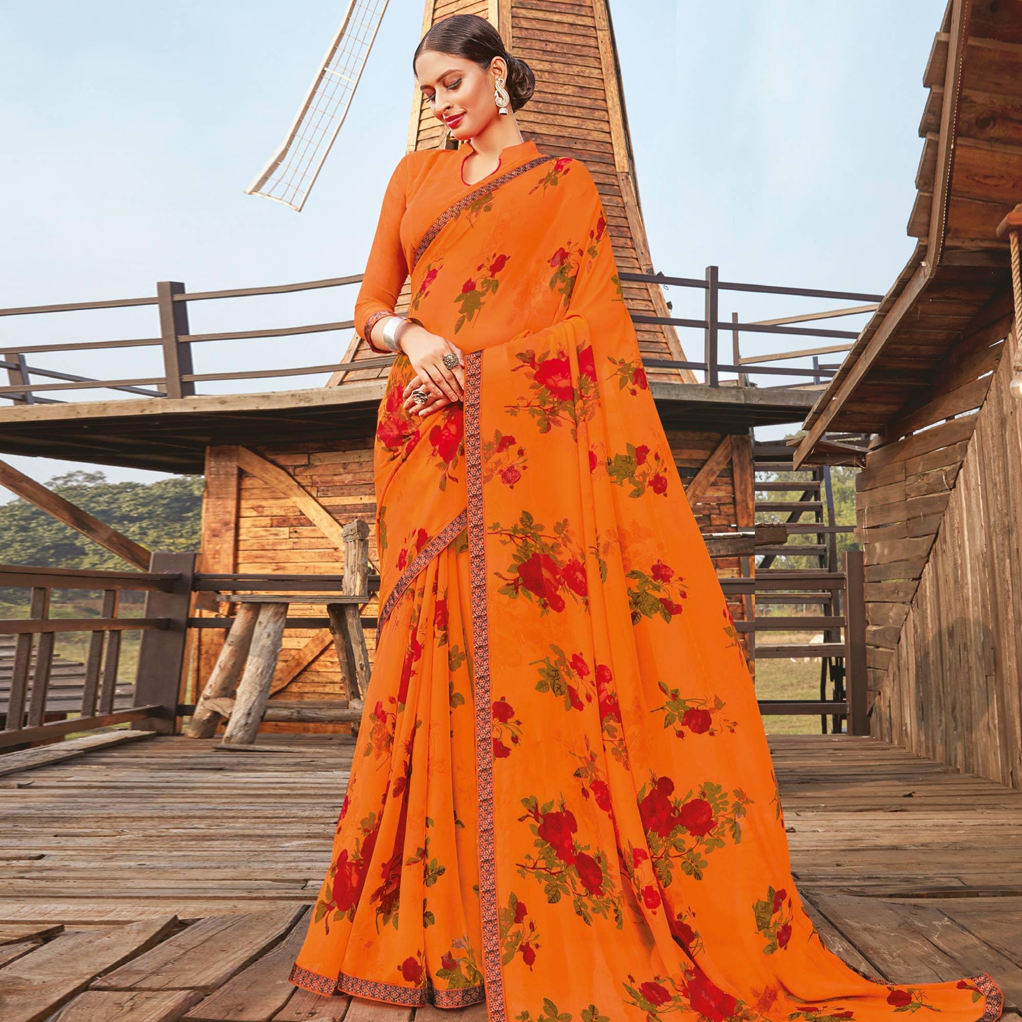 Peachmode Lovely Orange Coloured Partywear Pure Georgette Floral Printed Saree With Fancy Lace Border