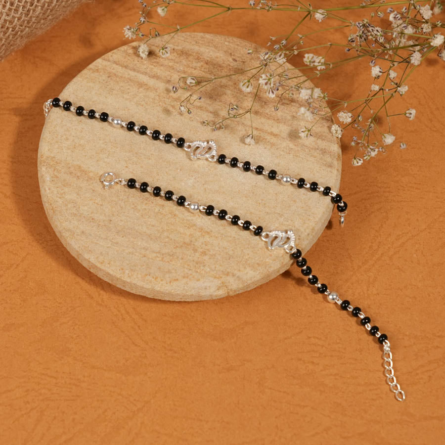 Prinjal Jewellers black beads with silver baby feet nazariya for kids - view 2