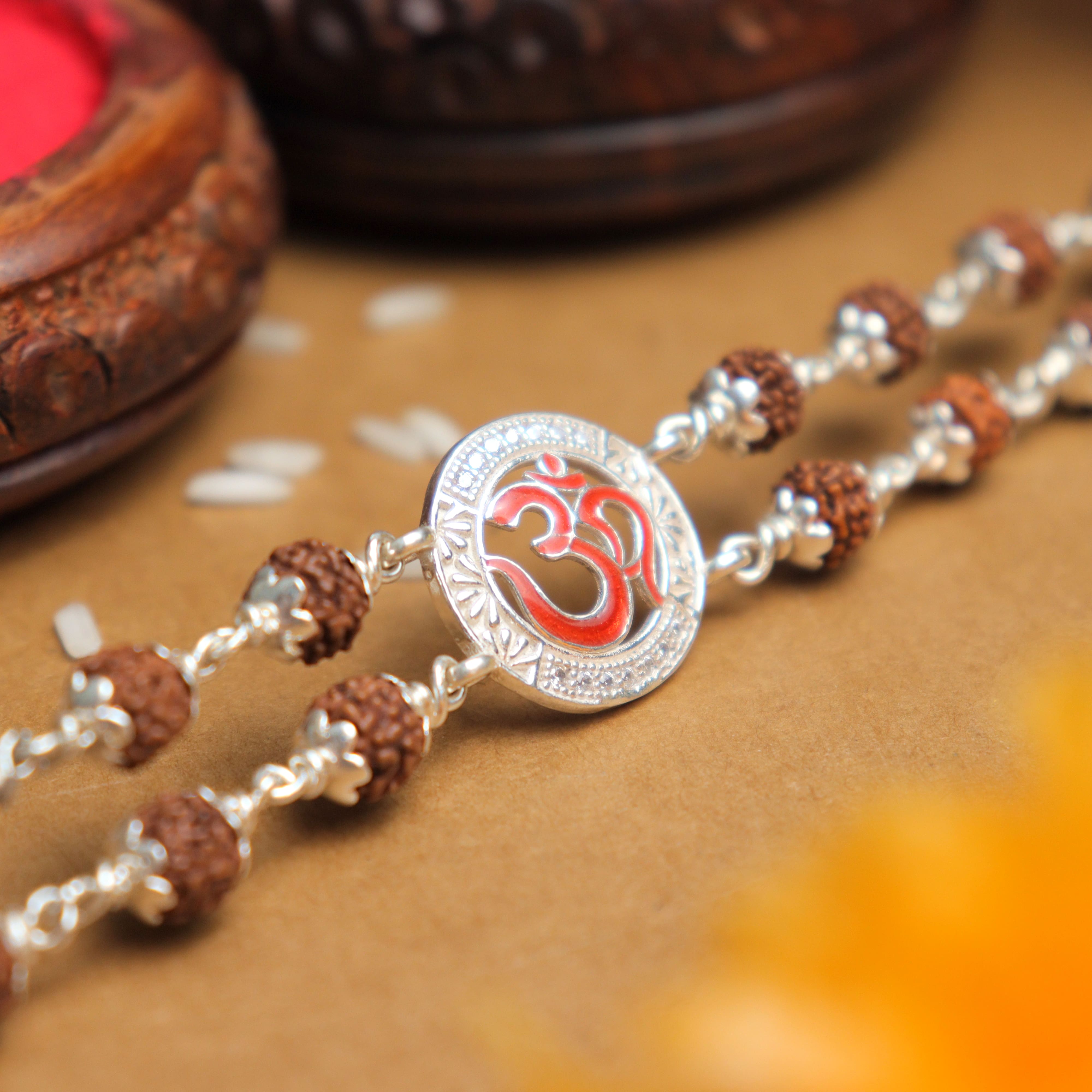 Prinjal Jewellers Silver Rakhi with Rudraksha, Om in Round Shape, Double Line Bracelet