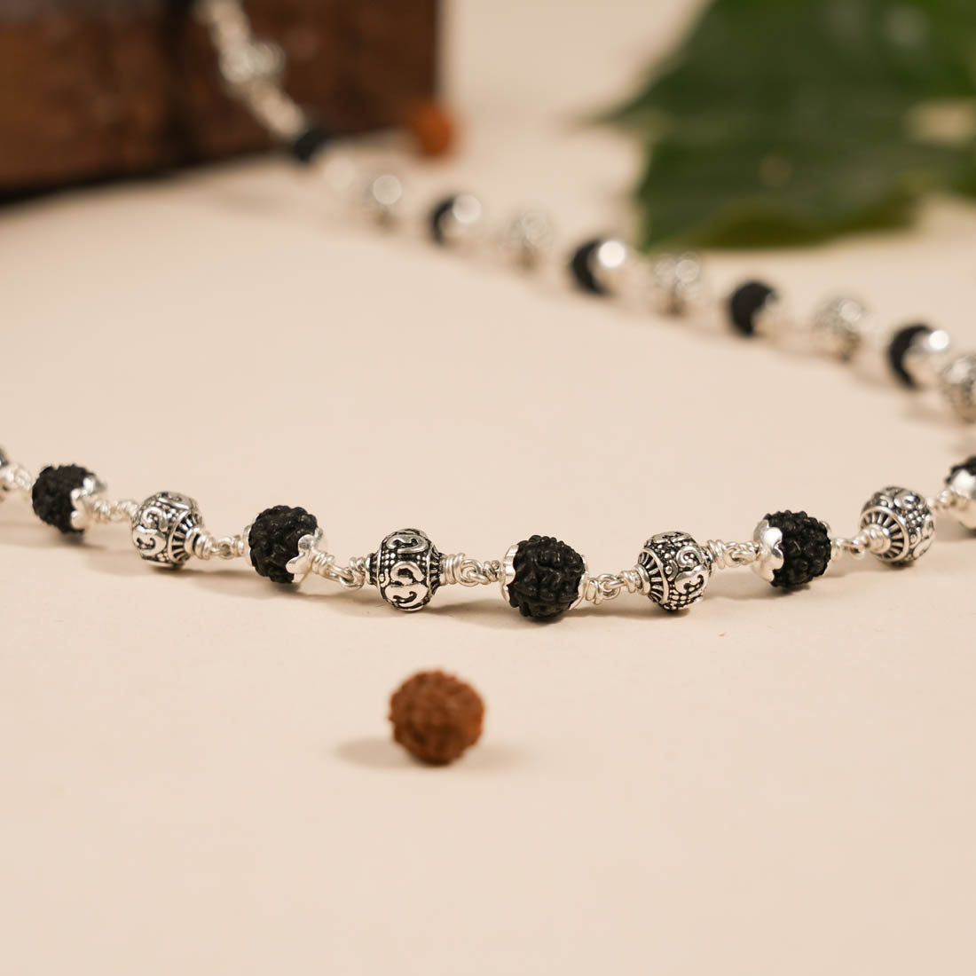 Prinjal Jewellers Black Rudraksha With Om Silver Beads Mala