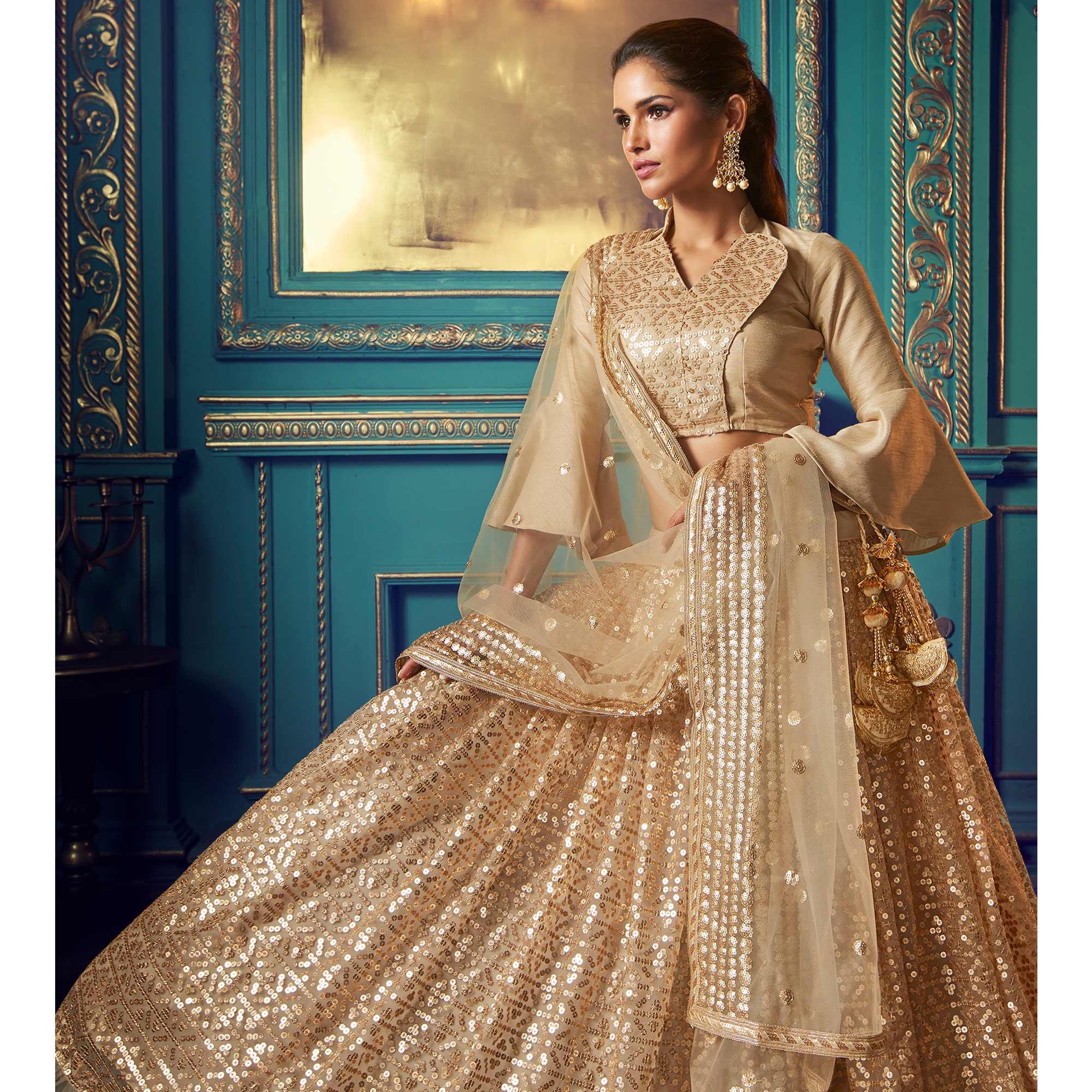 Peachmode Dazzling Beige Colored Partywear Embroidered Soft Net Lehenga Choli - view 2