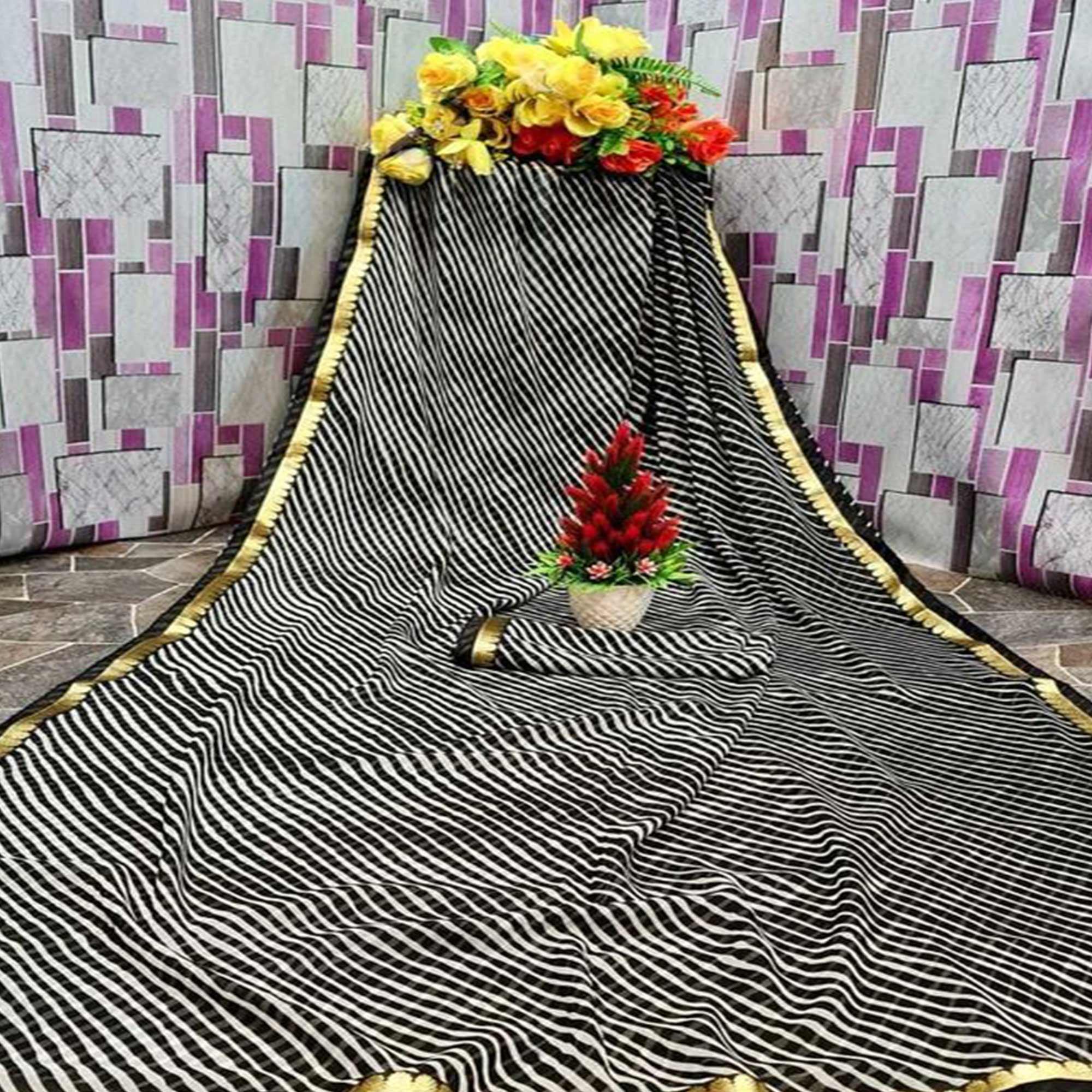 Peachmode Gleaming Cream & Black Coloured Casual Wear Printed Georgette Saree