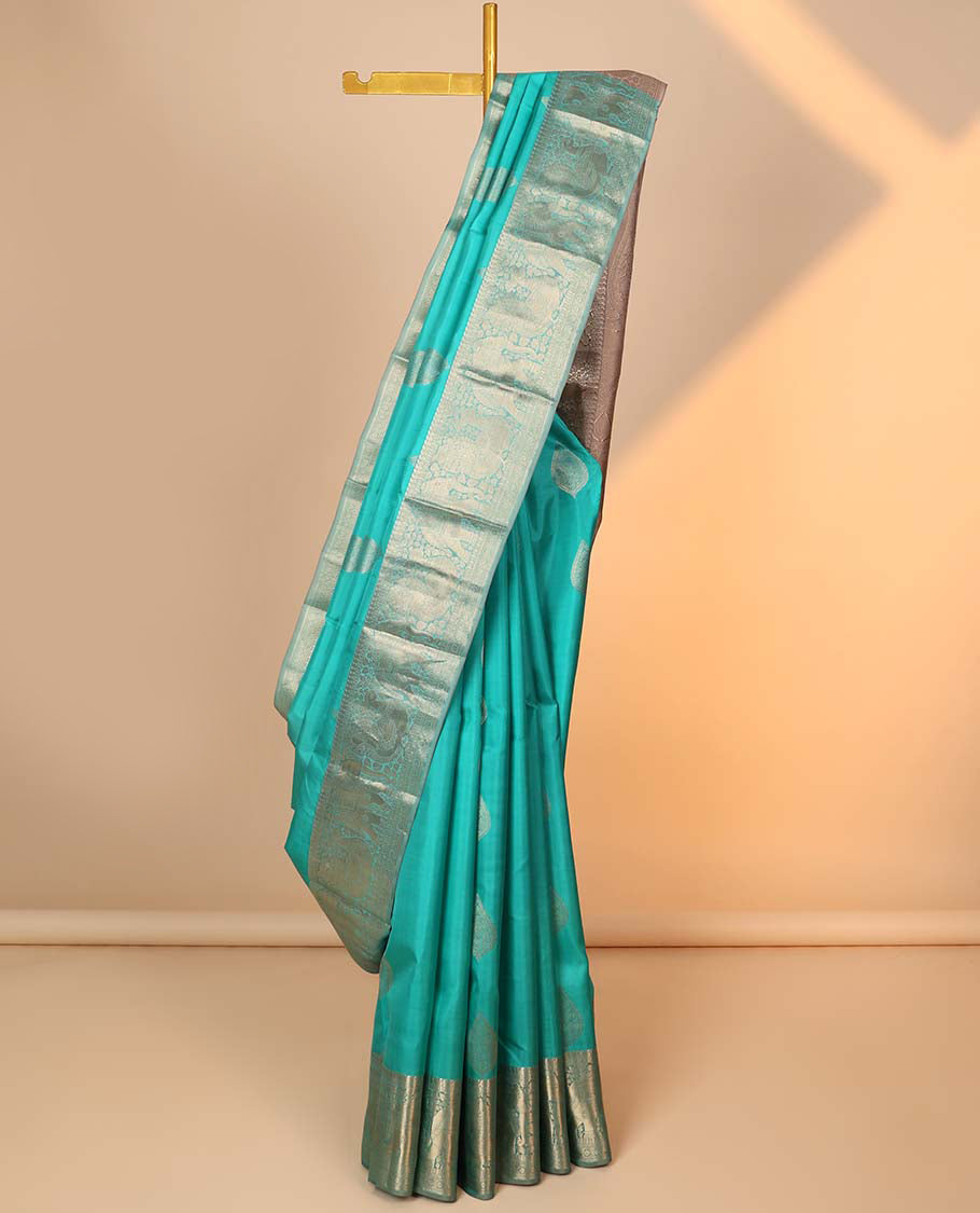 Pothys Blue zari buttas silk saree, zari border of manga,kamalam,muthu,mayil & yaanai & contrast intricate pallu