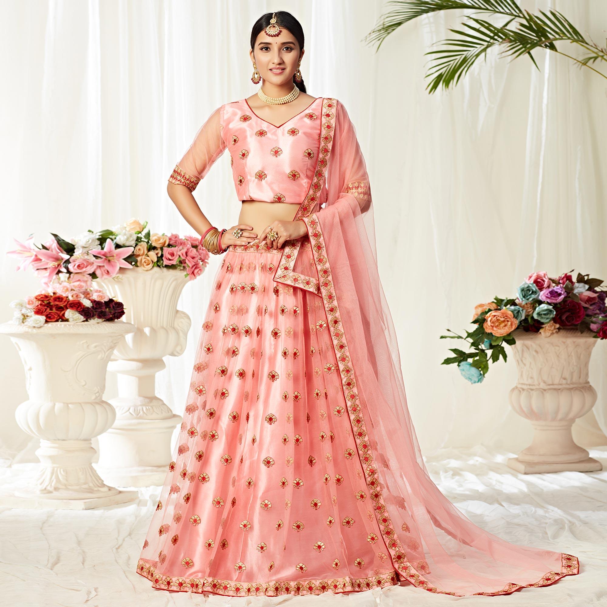 Peachmode Majesty Peach Colored Wedding Wear Embroidered Heavy Net Lehenga Choli