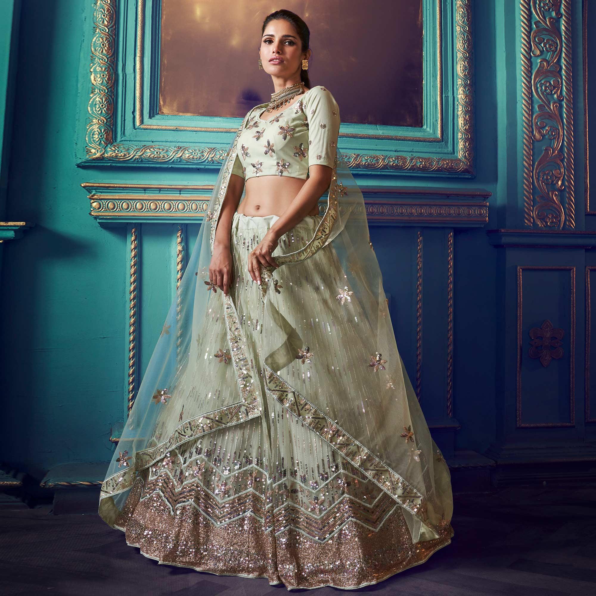 Peachmode Exotic Pastel Green Colored Partywear Embroidered Soft Net Lehenga Choli