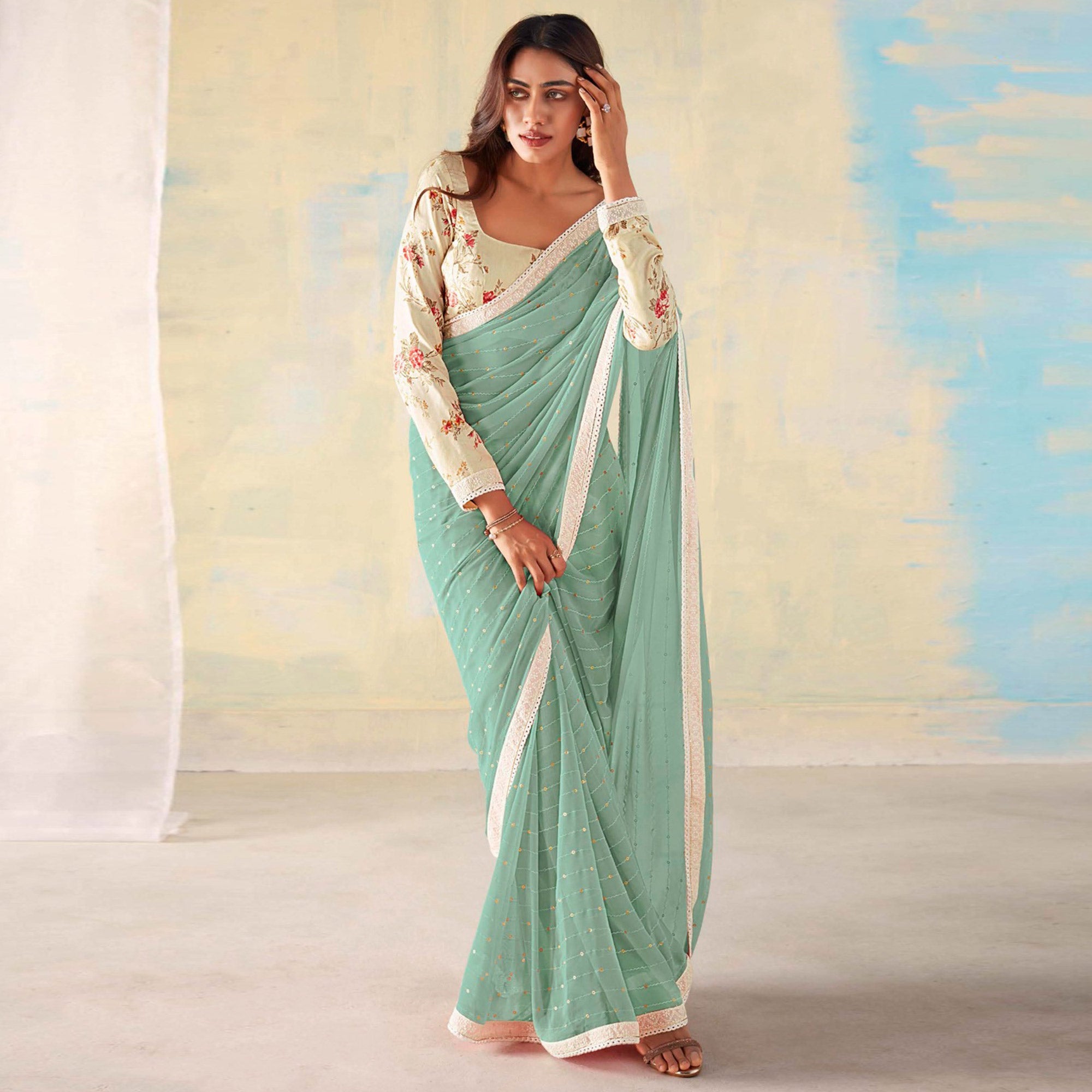 Peachmode Dusty Green Foil Printed Georgette Saree With Embroidered Border