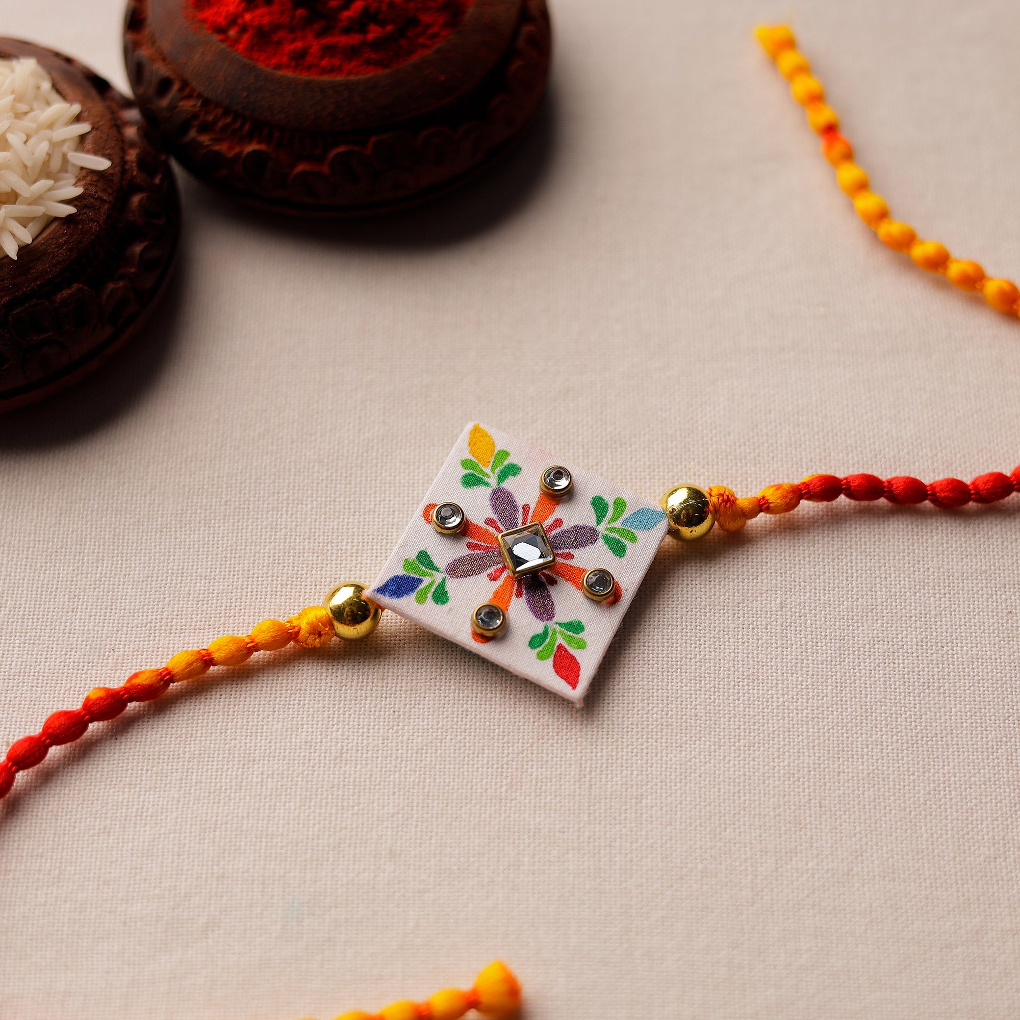 KHUSHBASH - HAPPY LOOM OF EAST Bishnupur Handpainted Fabric Rakhi 07
