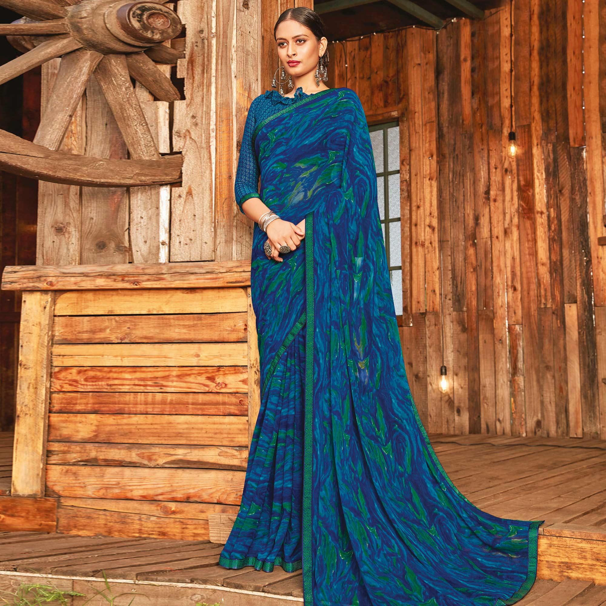 Peachmode Captivating Rama & Blue Coloured Partywear Pure Georgette Floral Printed Saree With Fancy Lace Border