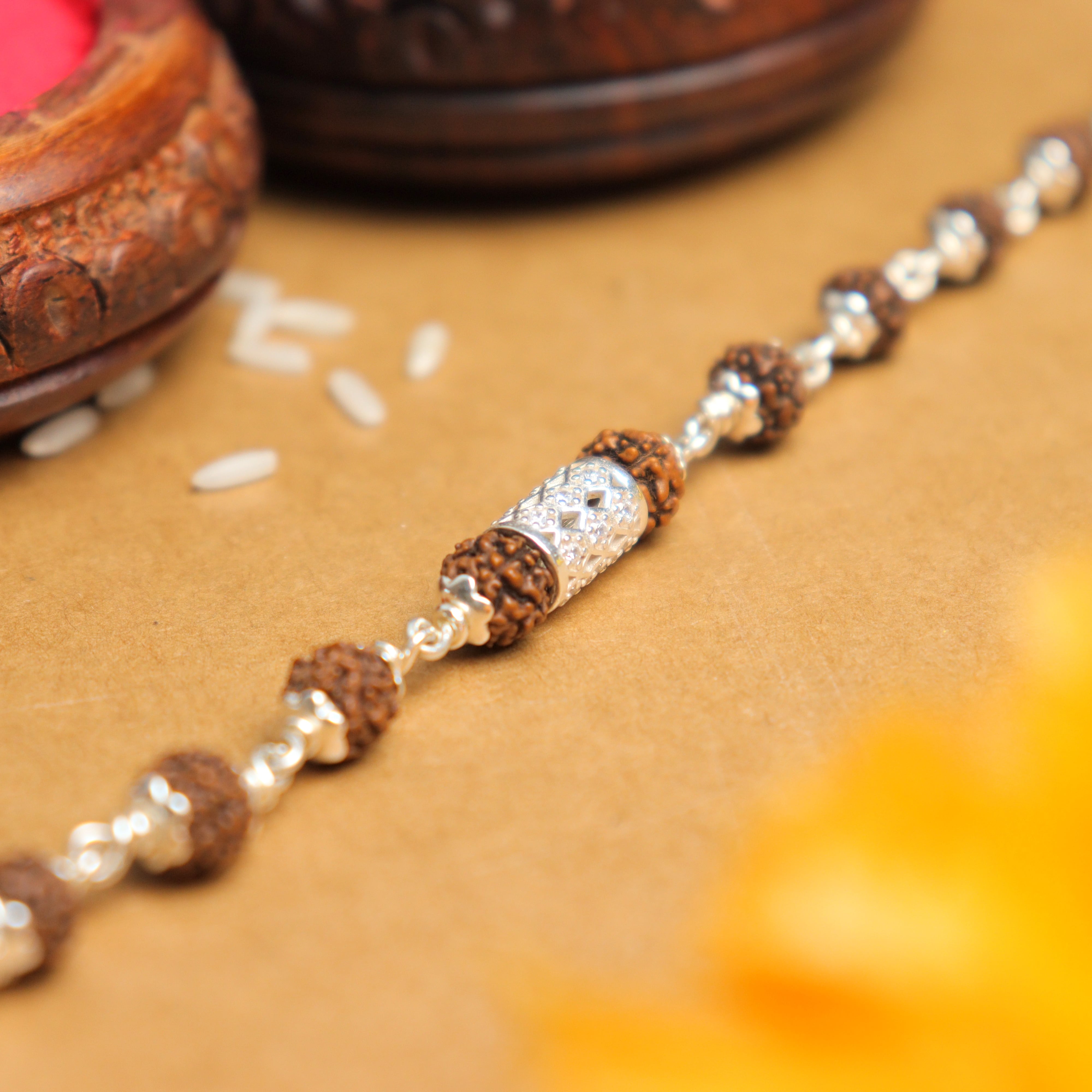 Prinjal Jewellers Silver Rakhi with Diamond Cylinder and Rudraksha