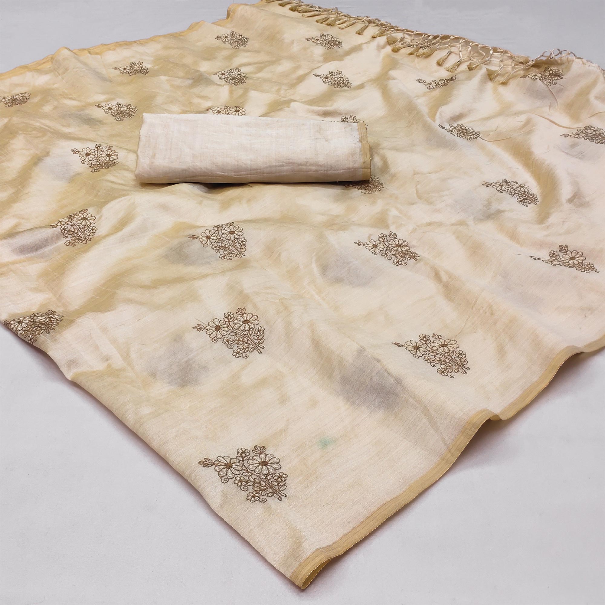 Peachmode Cream Floral Embroidered Assam Silk Saree With Tassels