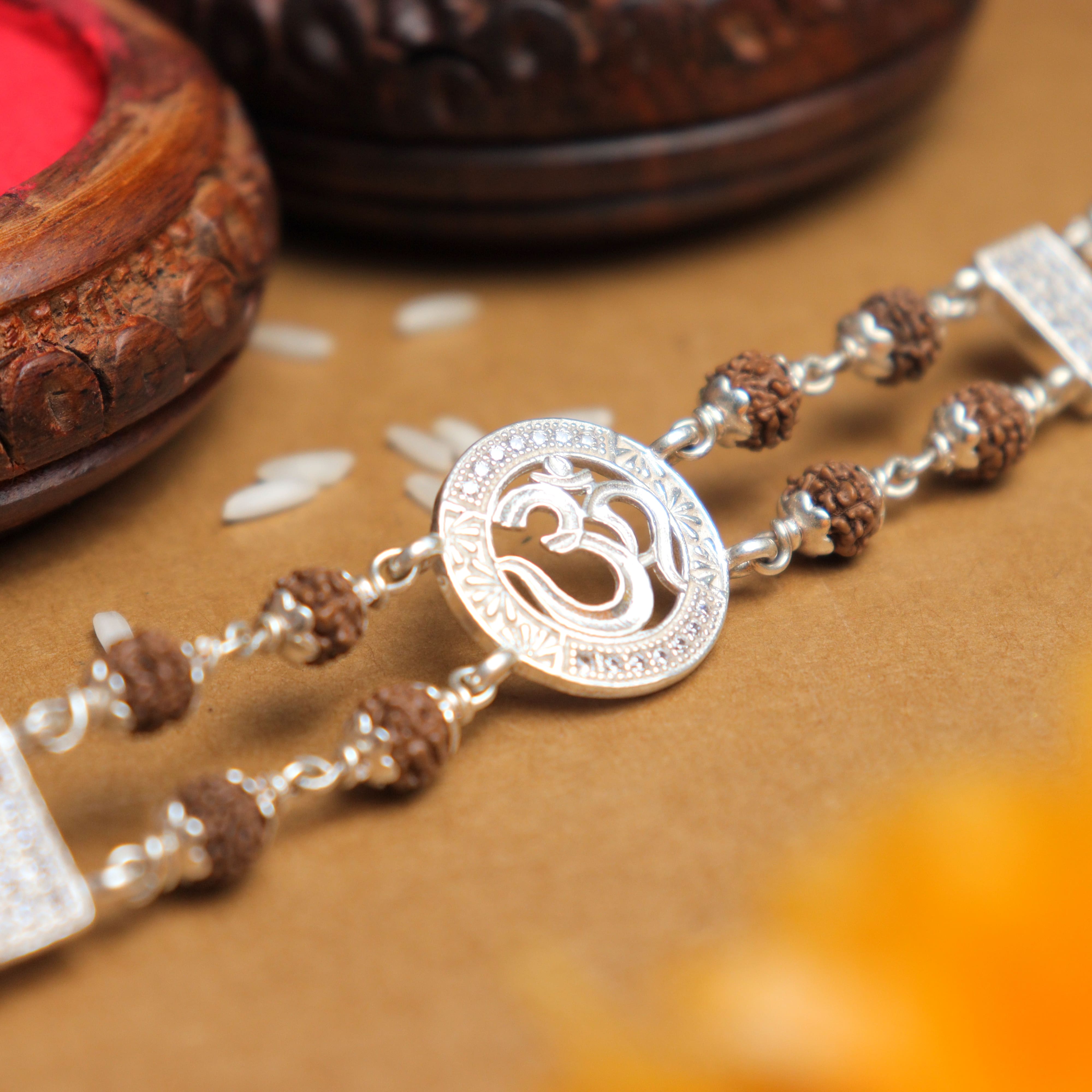 Prinjal Jewellers Silver Rakhi with Original Rudraksha, Central Om in Circular Sphere, Double Line Design for Men