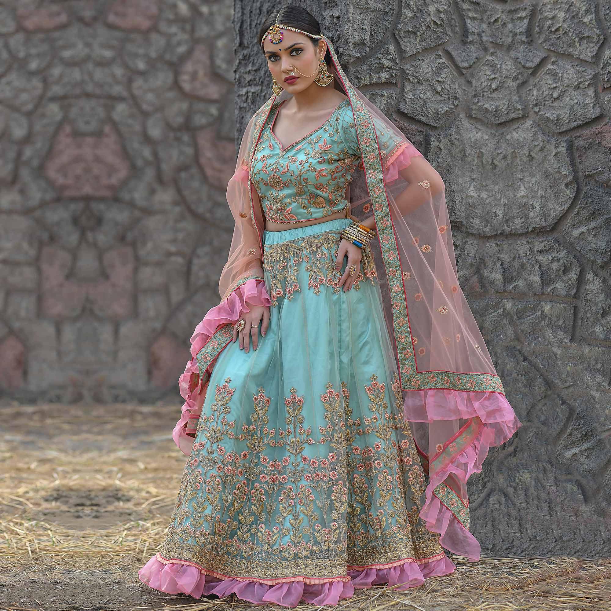 Peachmode Imposing Turquoise Colored Party Wear Embroidered Net Lehenga Choli